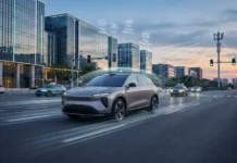 Software-Defined Mobility Powers Connected Vehicle Tech Autonomous silver SUV drives on a city street with holographic icons for OTA updates, V2X, and remote diagnostics.