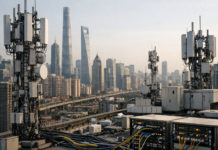 China 5G Connections Set to Reach 1.8 Billion by 2030 as Operators Plan $194 Billion Network Investment Rooftop telecom gear with antennas and cabinets overlooking a city skyline of tall skyscrapers.