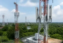 iSON Invests $300 Million in Philippines Telecom Towers Cellular communication towers with antennas atop a fenced equipment pad in a green, suburban area